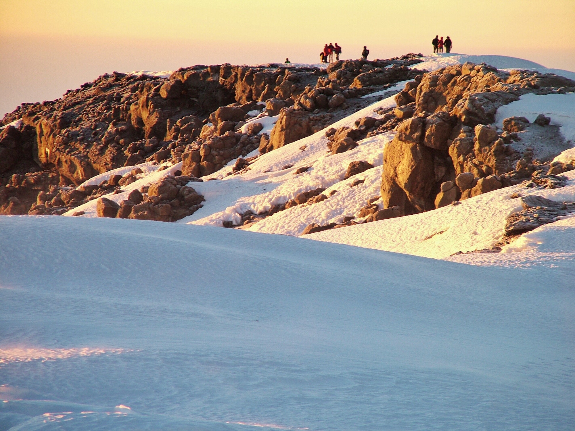 Hiking to the top of the mountain, Mt Kilimanjaro with lots of snow, rocks and a great sunrise